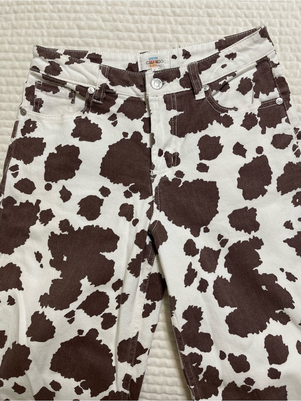 High-Rise Cow-Print Jeans in Brown & White